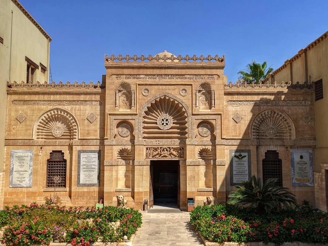 brown concrete building with green plants, The Coptic museum in Cairo