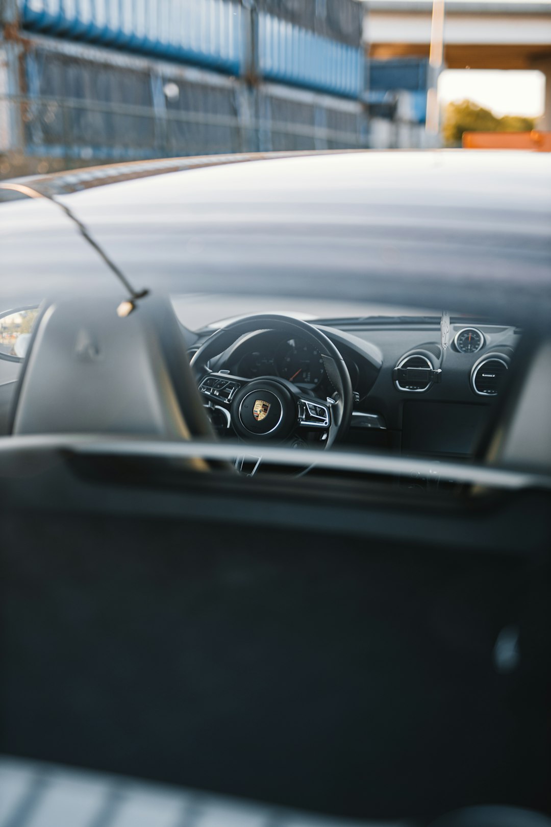 black car dashboard with a view of a road