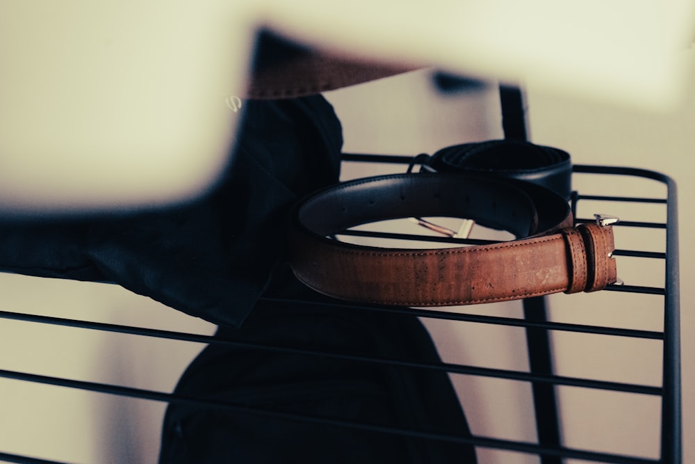 black and brown leather belt