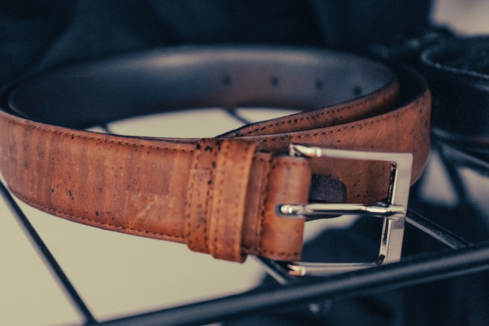 brown leather belt with silver buckle