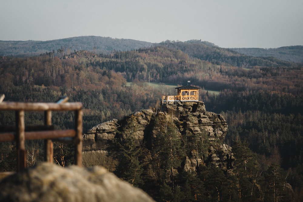 brown wooden fence on top of mountain during daytime