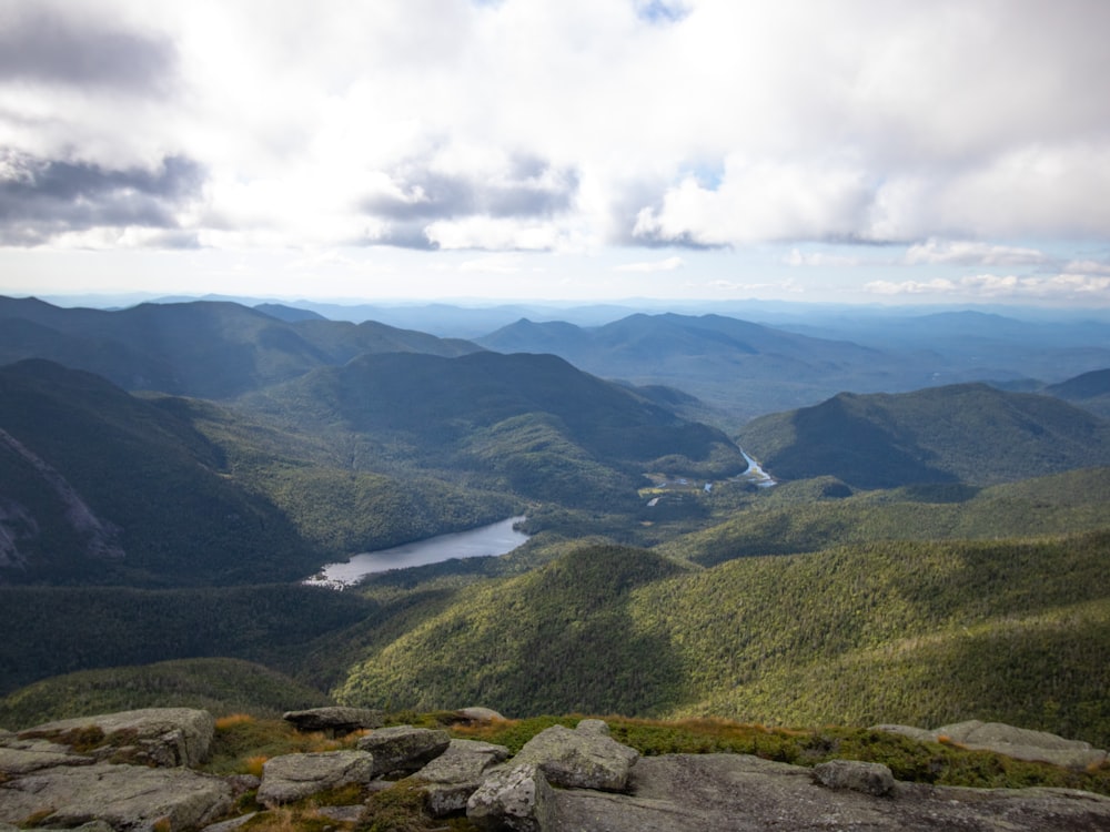 green mountains under white clouds during daytime