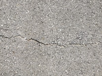 Close-up of concrete repair work showing durable materials being applied.