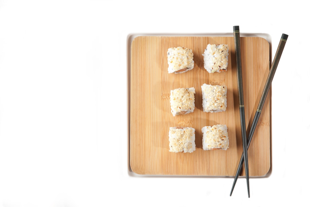 chopsticks fork n knife, chopsticks, brown wooden tray with sushi