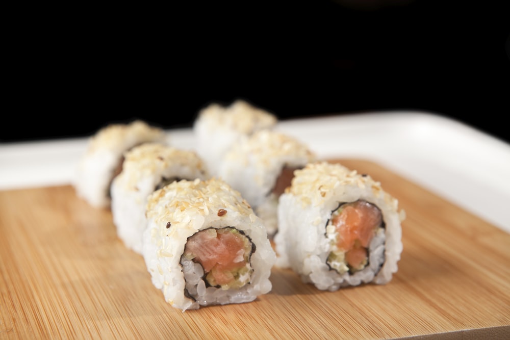 white sushi on brown wooden table