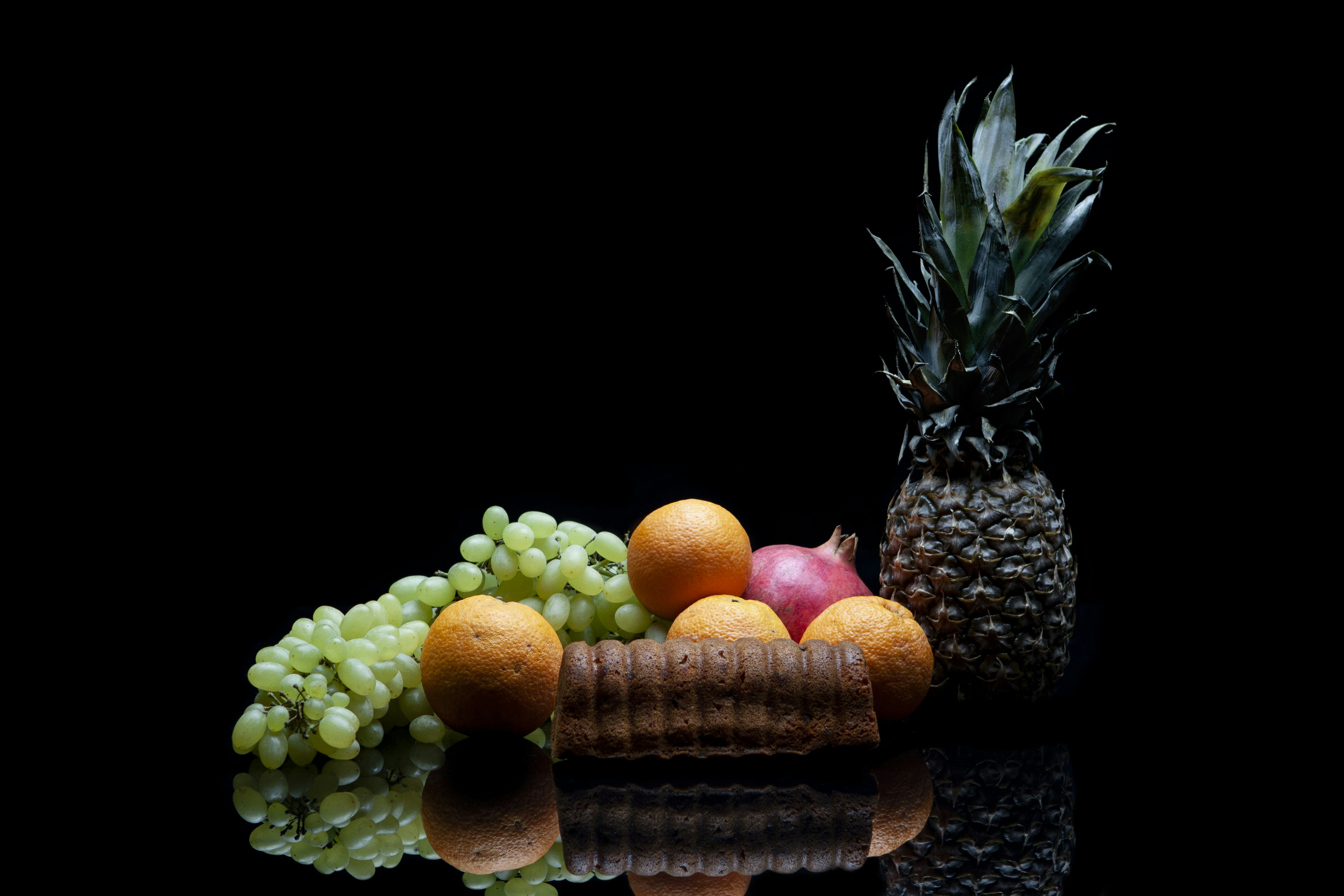 orange fruits on brown woven basket fruitcake teams background