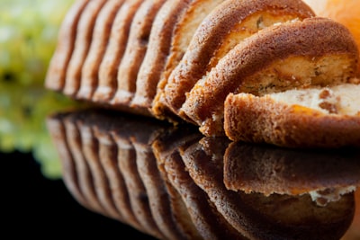 brown and white pastry on white ceramic plate fruitcake google meet background