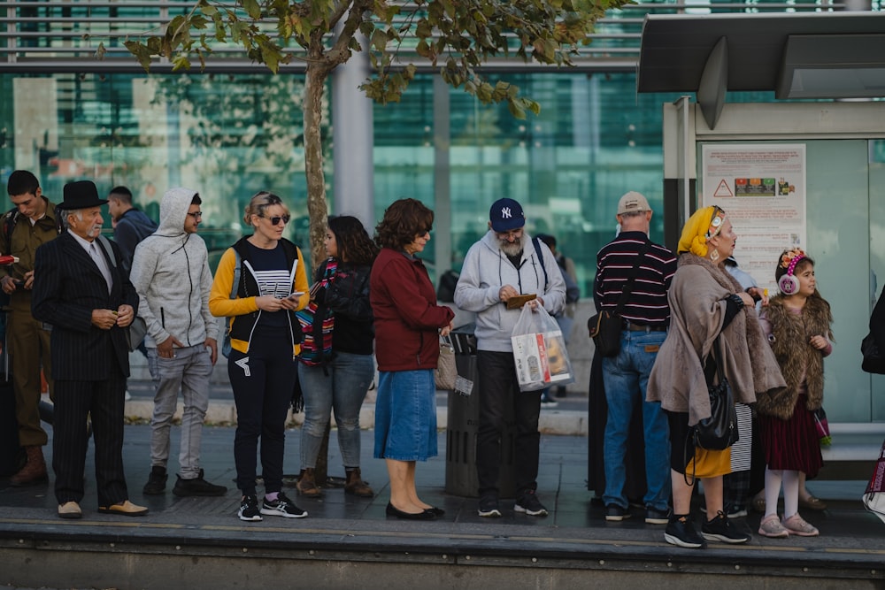 people standing on sidewalk during daytime