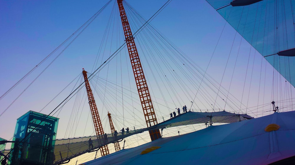 orange and white metal tower under blue sky during daytime