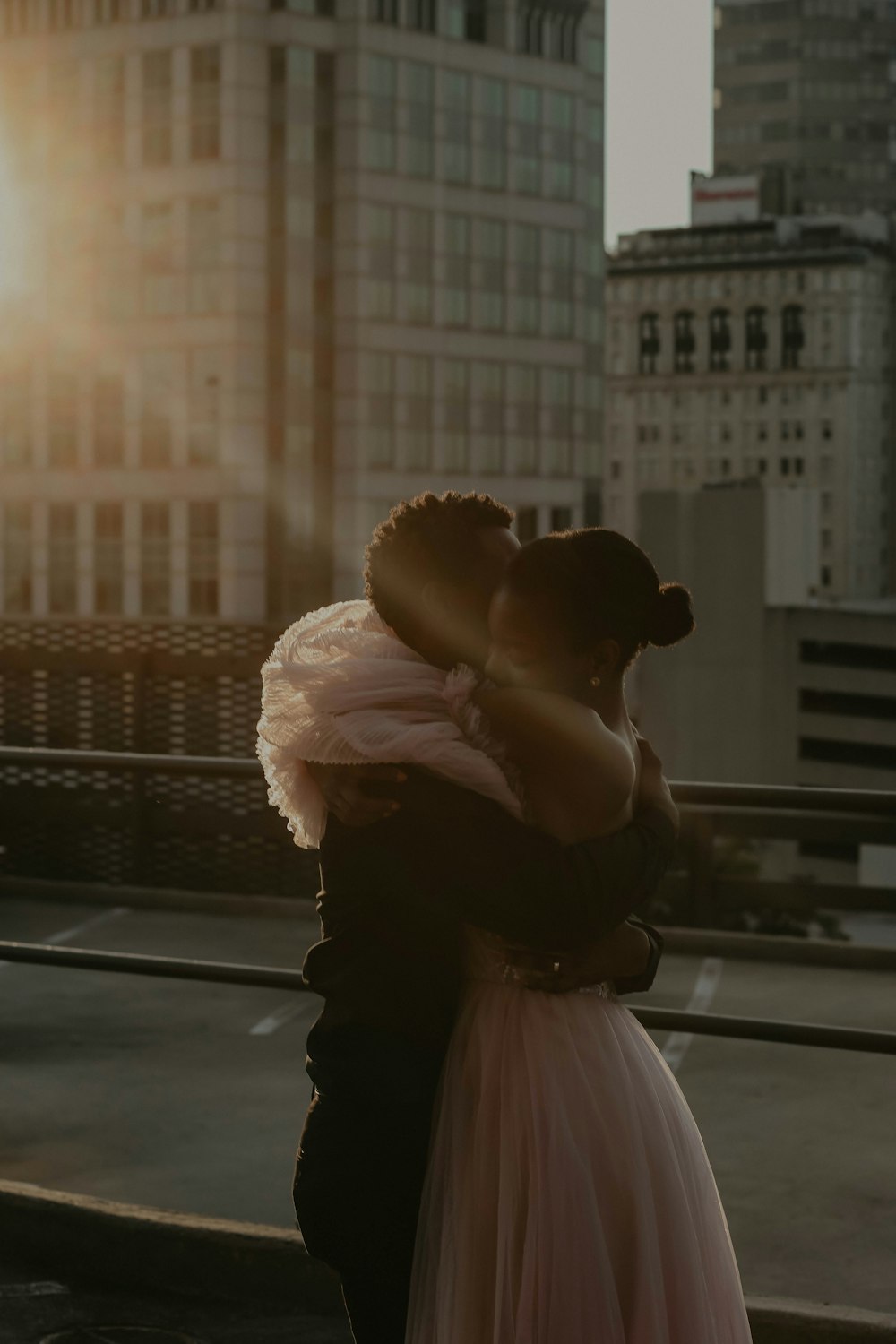 man kissing womans forehead