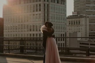 woman in white dress standing on sidewalk during daytime