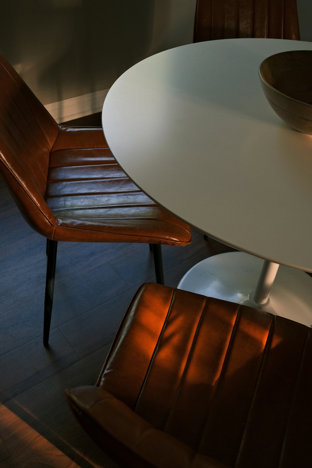 brown wooden chair beside white table