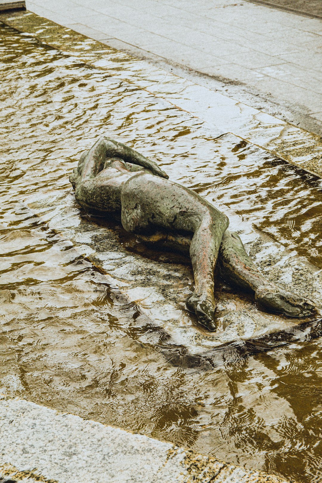 gray concrete statue on water