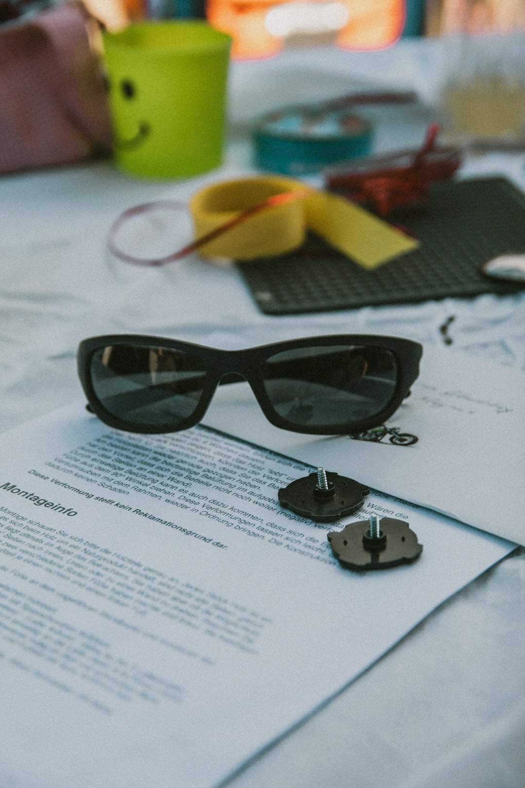 black framed sunglasses on white printer paper