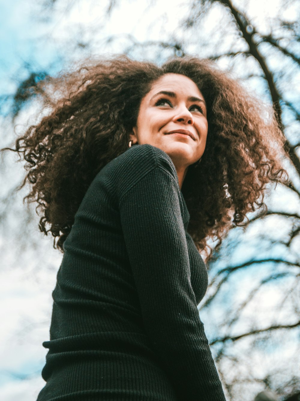 woman in black turtleneck sweater