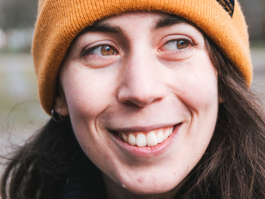 woman in brown knit cap