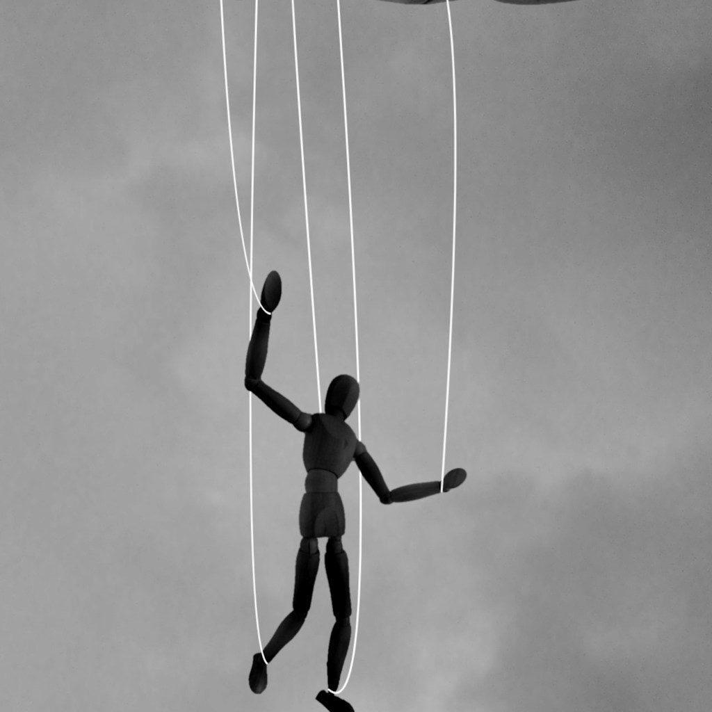 2 men playing basketball in grayscale photography