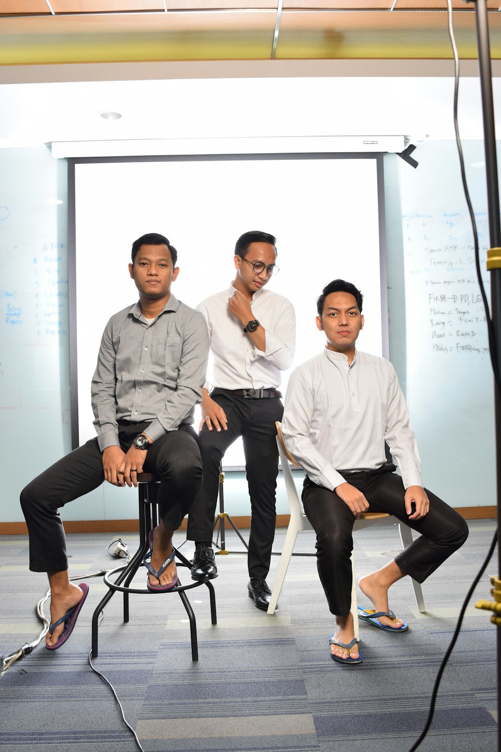 3 women and man sitting on chair