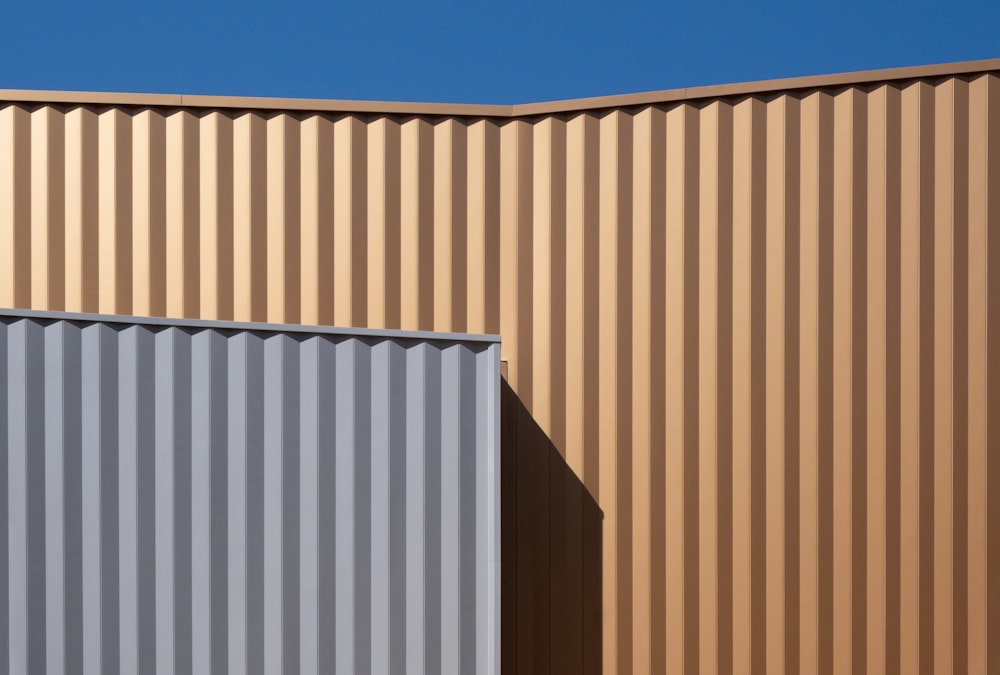 brown and white concrete building under blue sky during daytime