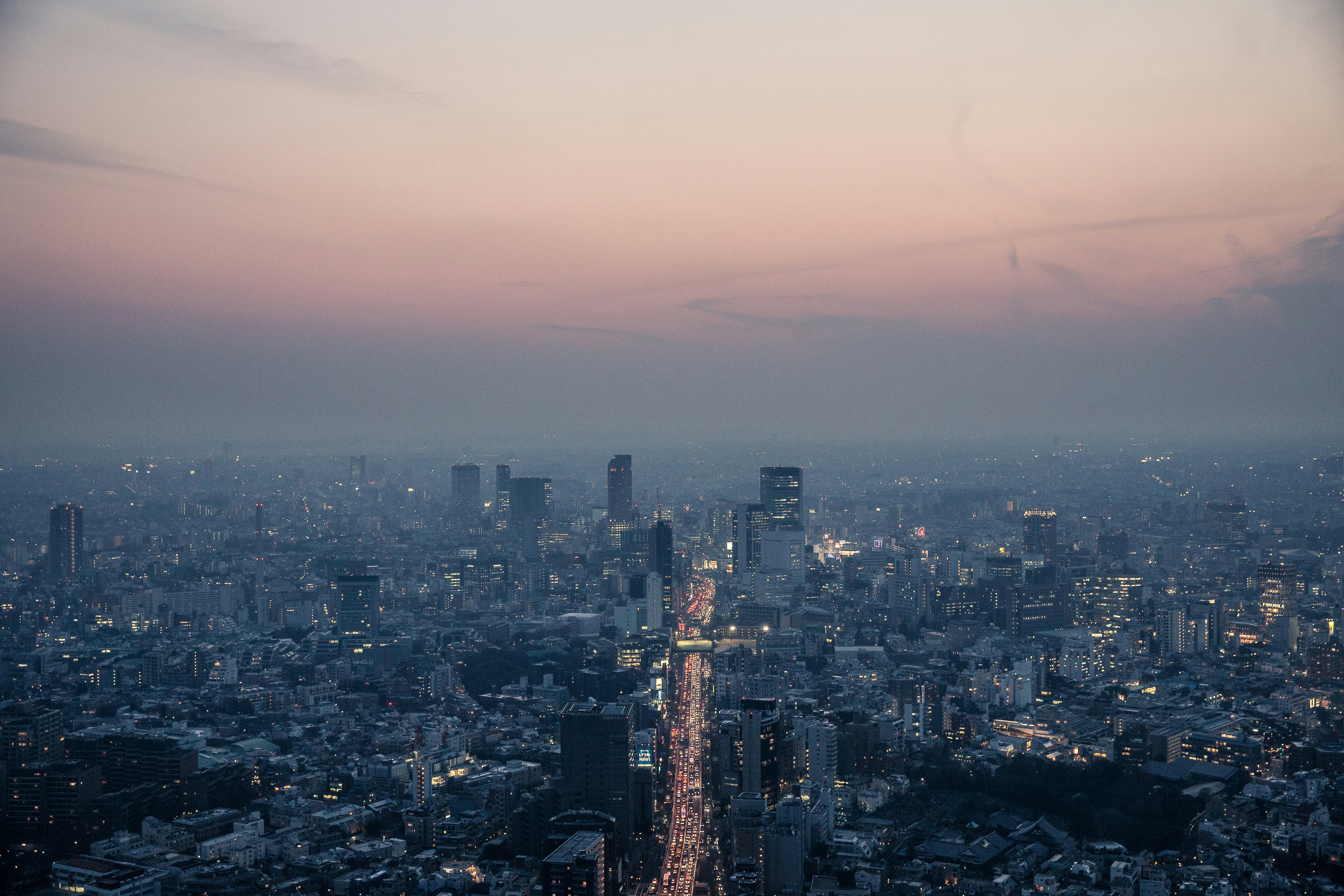 aerial view of city buildings during night time smoggy teams background