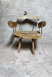 Elegant wooden chair with stone accents in a cozy room setting