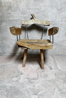 Elegant wooden chair with stone accents in a cozy room setting