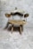Elegant handcrafted rustic wooden chair with detailed natural textures.
