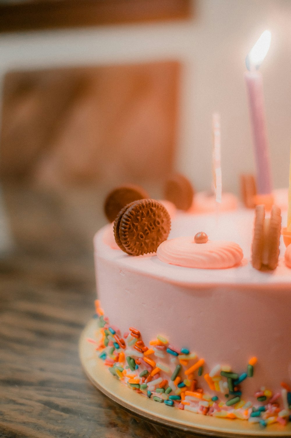 white and pink cake with pink straw