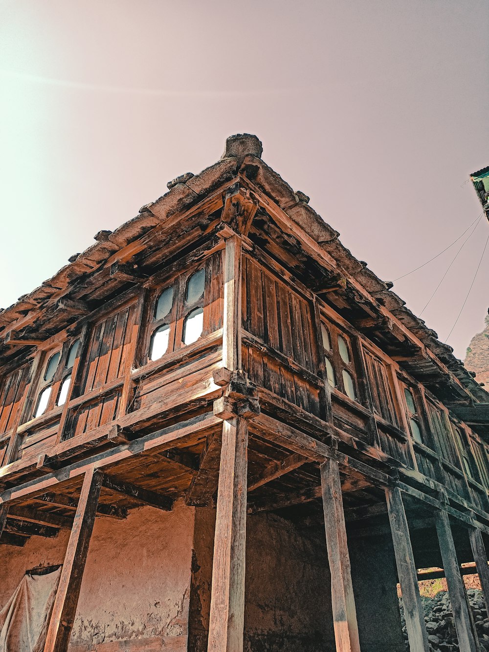 brown wooden house under white sky during daytime