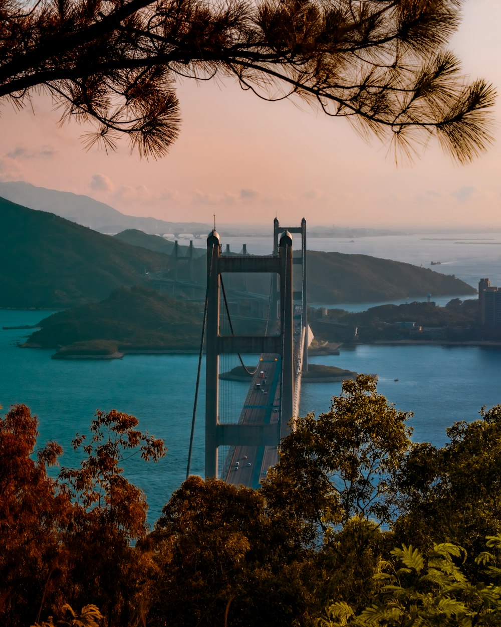 gray metal bridge over body of water during daytime