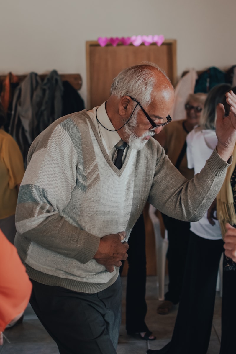 Senior doing standing exercises at home