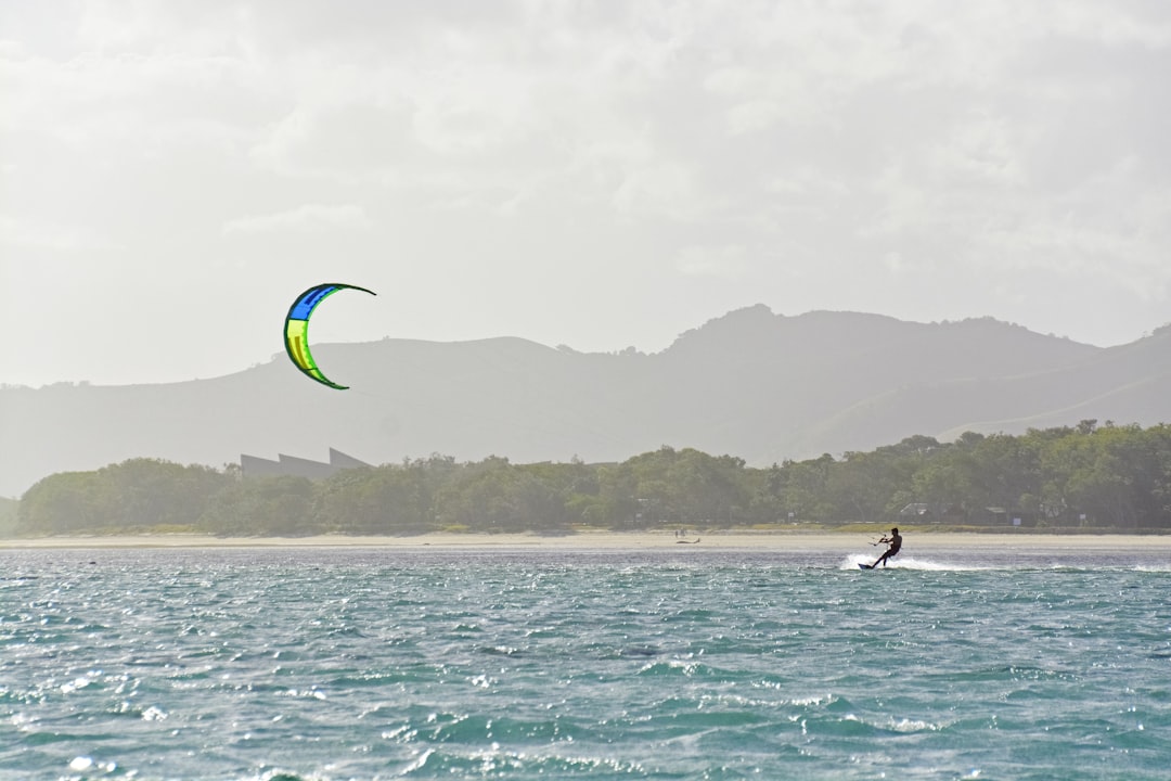 people surfing on sea during daytime