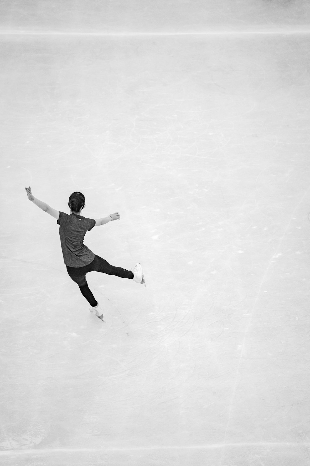 man in white t-shirt and black pants jumping