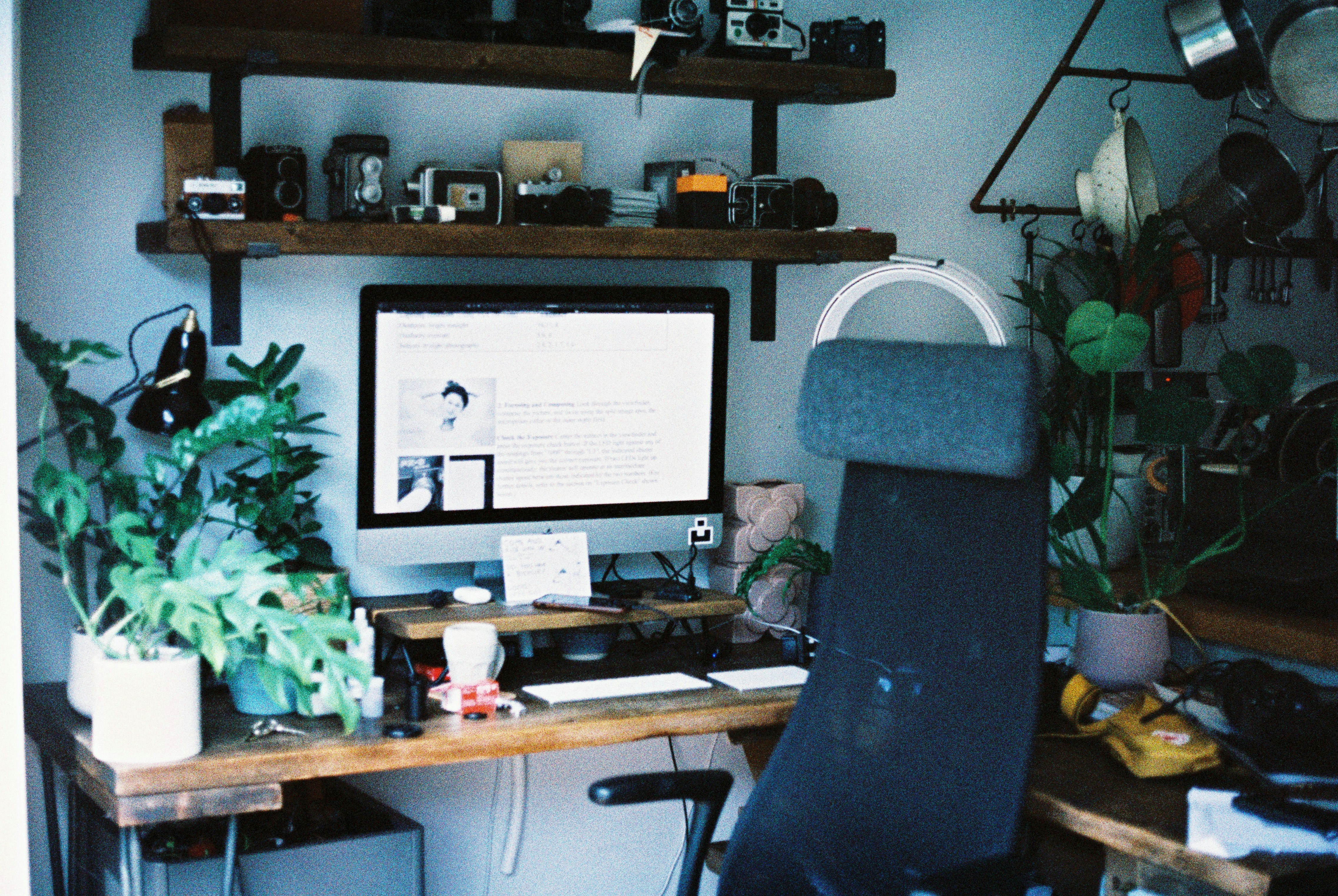 Black computer monitor on wooden desk