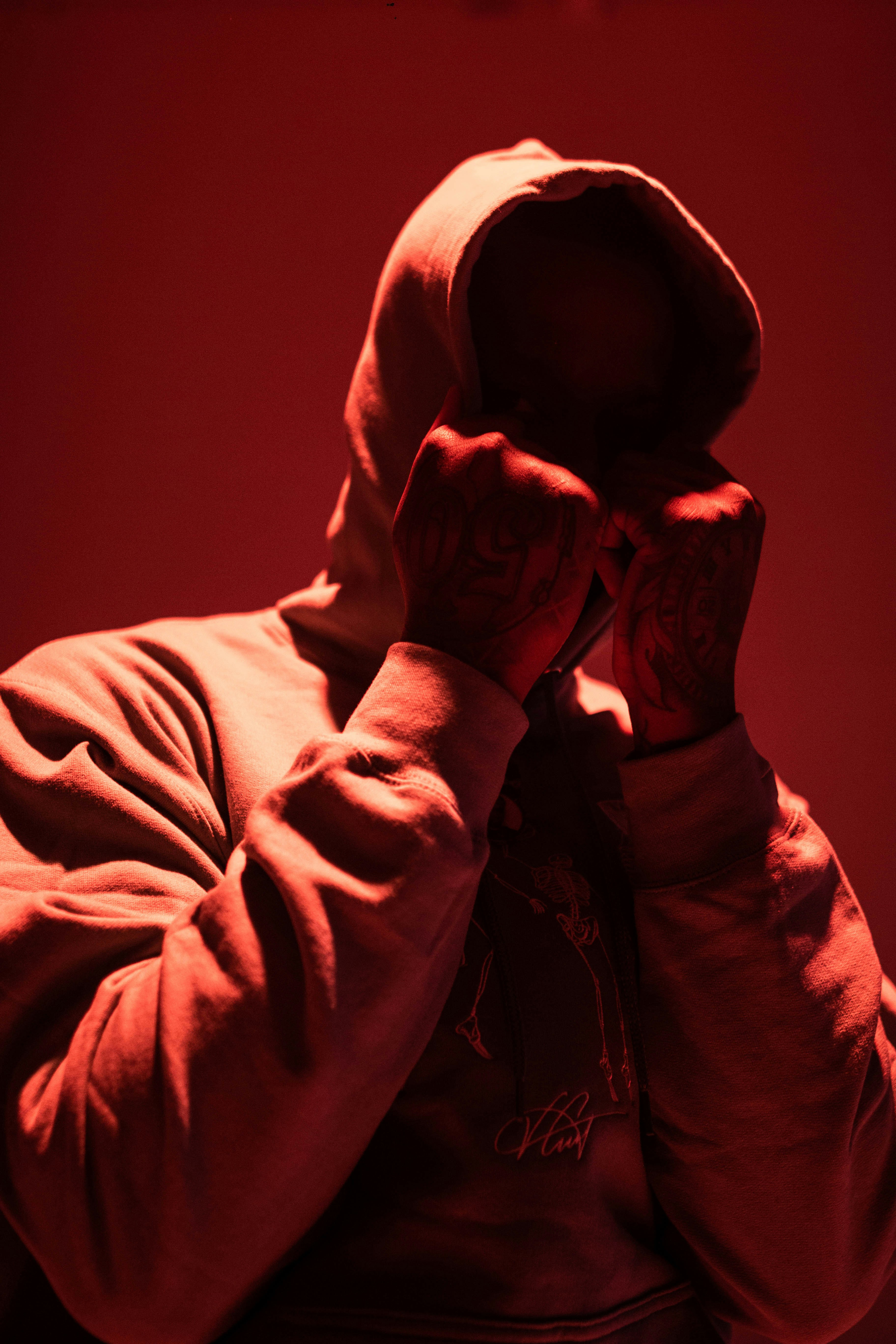 Man in hoodie covering his face photo Free Clothing Image on Unsplash