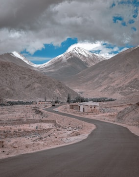brown and white mountains under blue sky during daytime