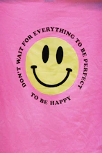 a pink towel with a smiley face on it