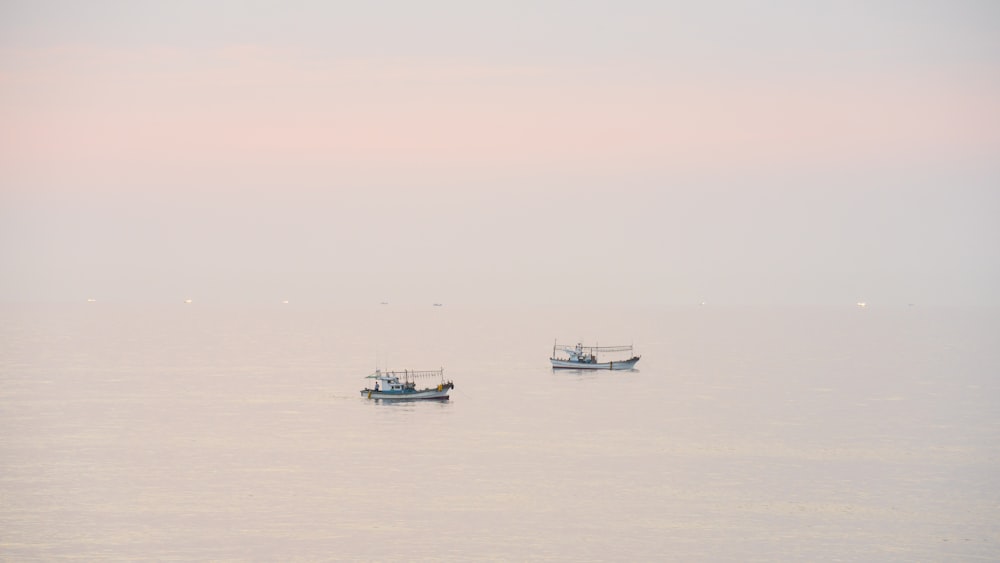 white boat on sea during daytime