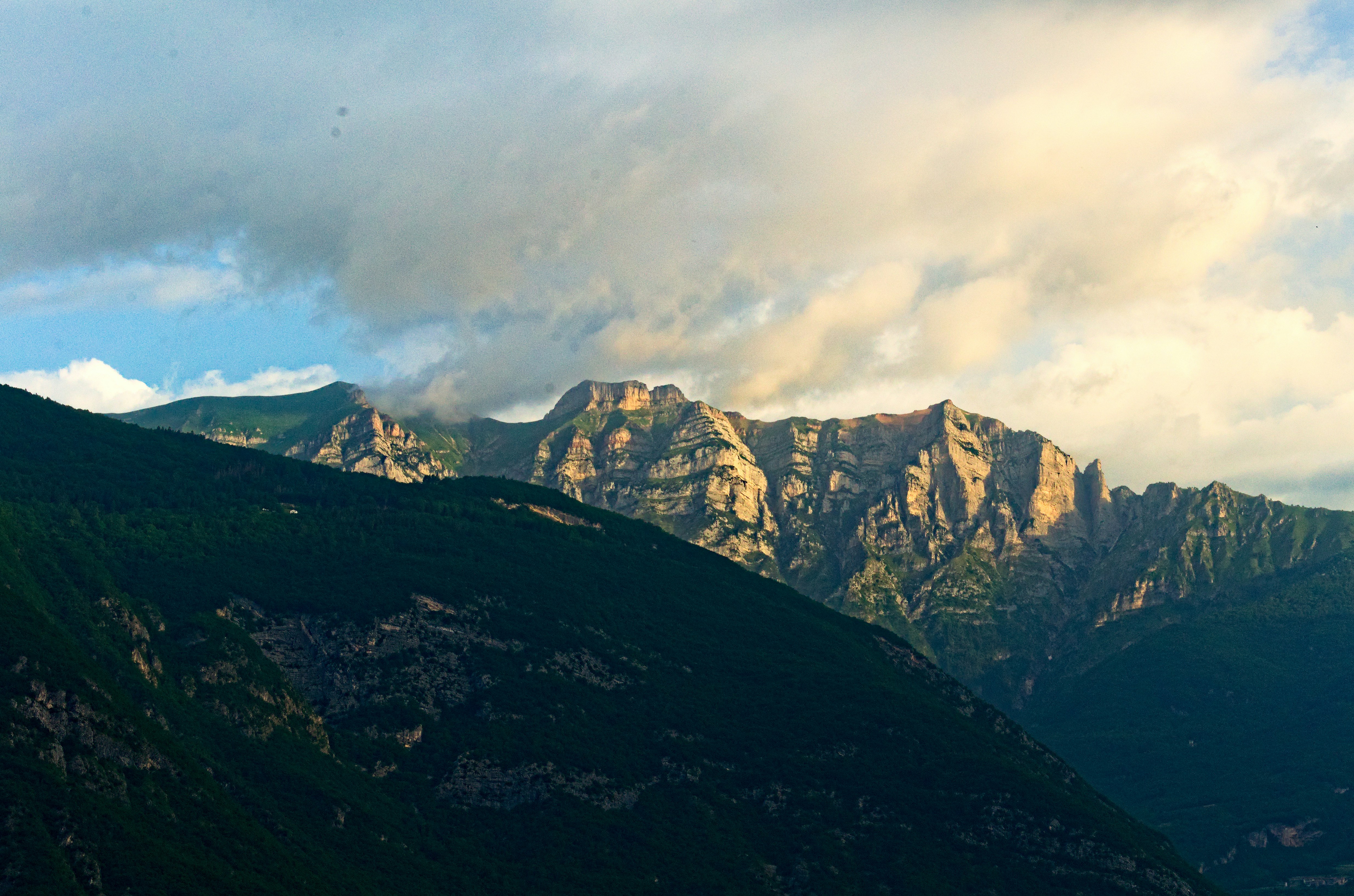 brown and gray rocky mountain under gray cloudy sky during daytime