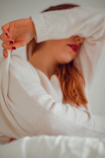 woman in white knit sweater
