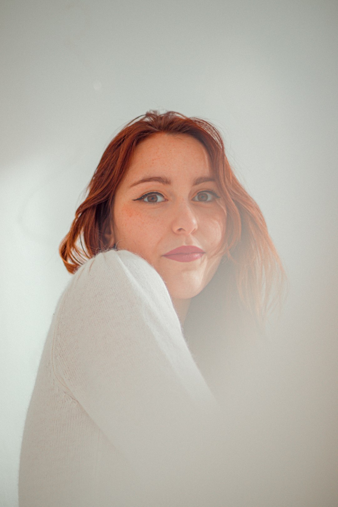 woman in white long sleeve shirt