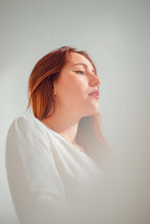woman in white long sleeve shirt