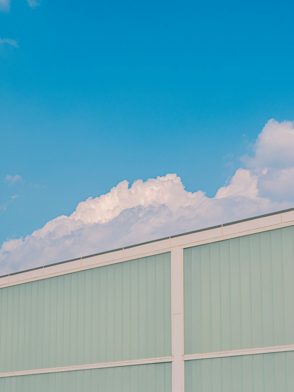 white and beige building under blue sky during daytime