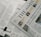 A section of a newspaper is placed over an open magazine. The newspaper displays a headline about the distribution of ex gratia finance and includes several smaller images and text flags. The magazine features articles and highlights, including historical and political content, with images and diagrams accompanying the text. The overall composition suggests a mix of current news and historical retrospectives.