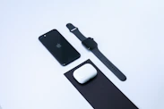 A sleek, modern display of assorted tech gadgets on a clean white background.