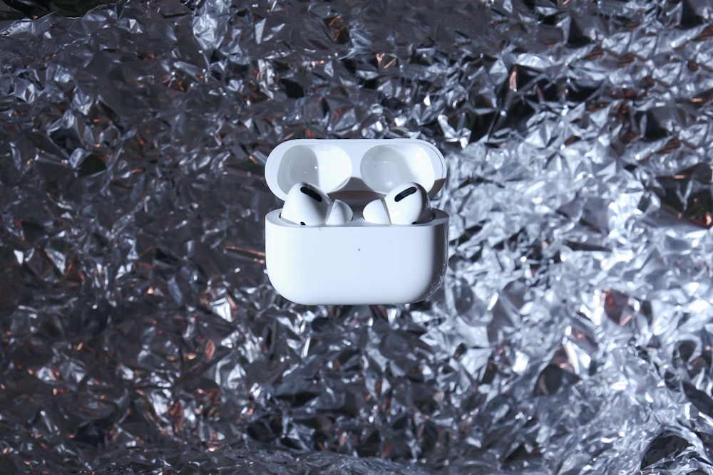 white ceramic bowl on dried leaves