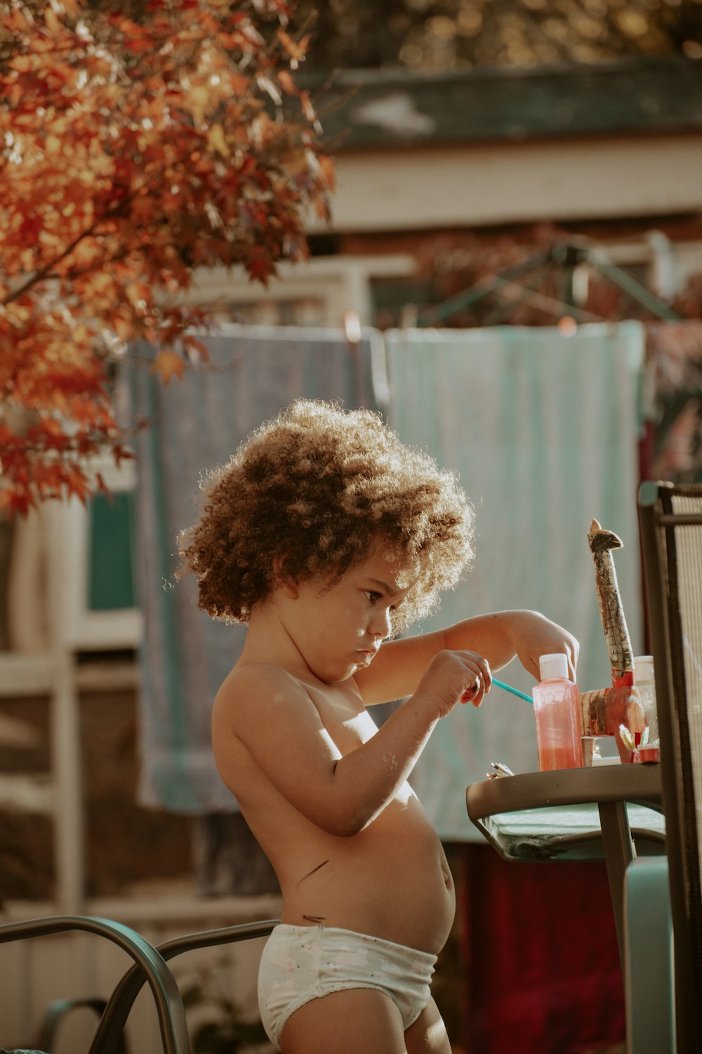 topless woman sitting on chair