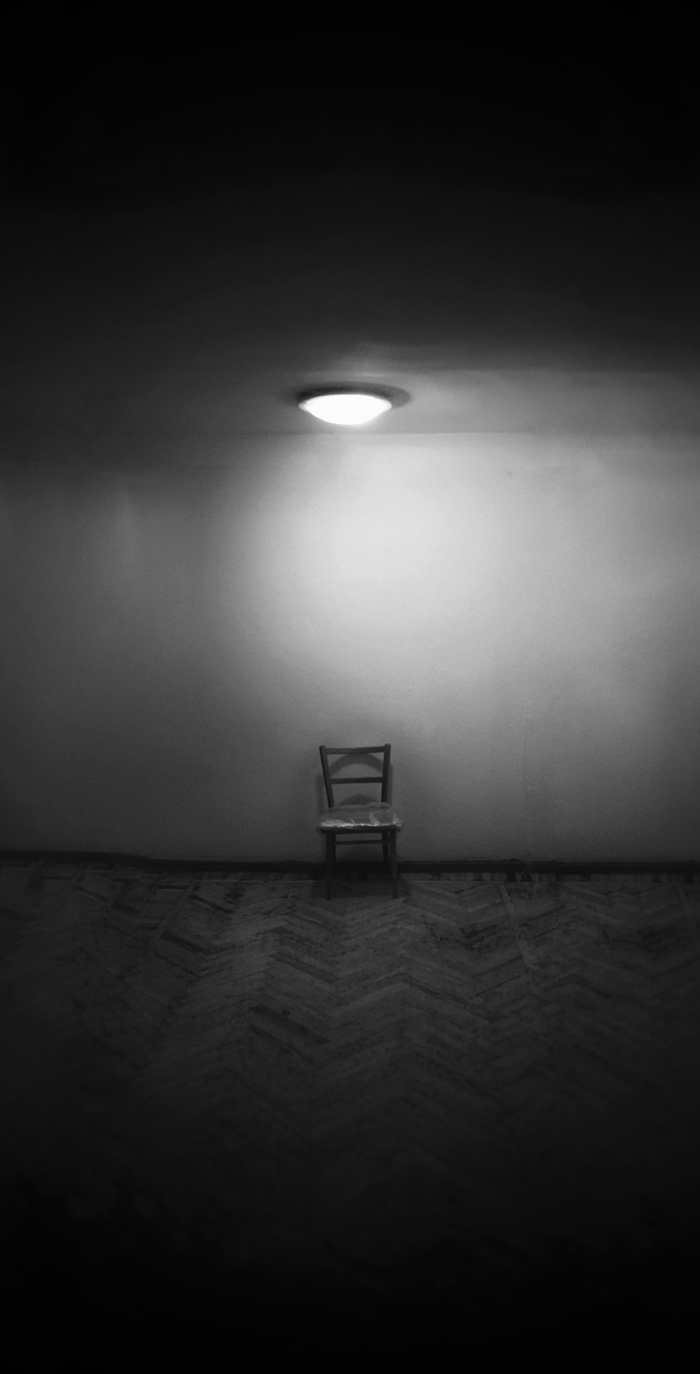 black metal chair on gray floor