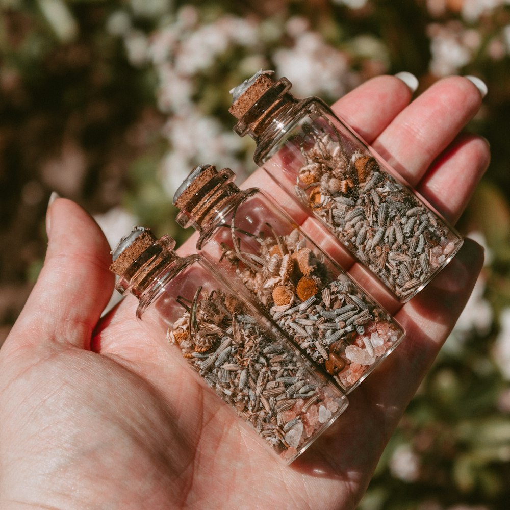 clear glass bottle with brown liquid