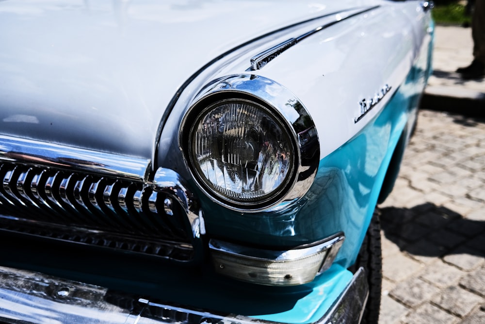 teal car with white and black license plate